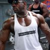 bodybuilder wearing power x purpose muscle stringer vest