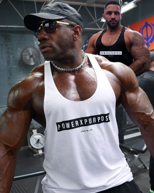 bodybuilder wearing power x purpose muscle stringer vest