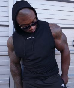 muscular man wearing power x purpose quick dry tank top for the gym.