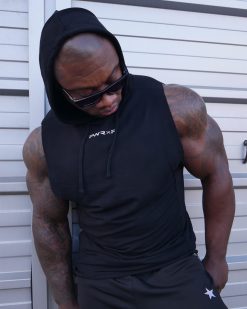 muscular man wearing power x purpose quick dry tank top for the gym.