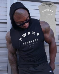 muscular man wearing power x purpose quick dry tank top for the gym.