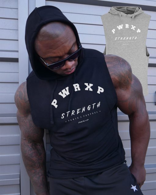 muscular man wearing power x purpose quick dry tank top for the gym.