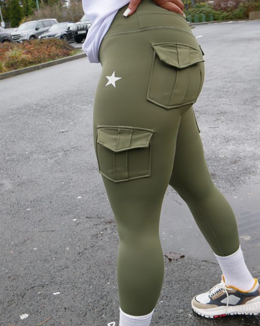 curvy girl wearing power x purpose cargo workout leggings in green which come in plus size xxl