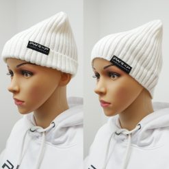 girl wearing power x purpose flip down beanie wooly hat in white.