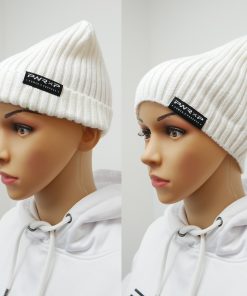 girl wearing power x purpose flip down beanie wooly hat in white.