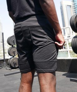Boxer wearing power x purpose fitted sports shorts training at KO8 outdoor gym in Dubai marina.
