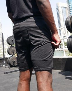 Boxer wearing power x purpose fitted sports shorts training at KO8 outdoor gym in Dubai marina.