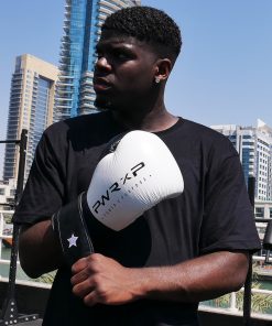 Boxer wearing power x purpose impact boxing gloves training at KO8 outdoor gym in Dubai marina.