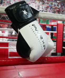 power x purpose impact boxing gloves hanging from ring at connellys gym birmingham.