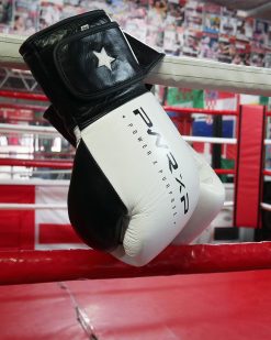 power x purpose impact boxing gloves hanging from ring at connellys gym birmingham.