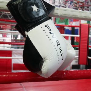 power x purpose impact boxing gloves hanging from ring at connellys gym birmingham.
