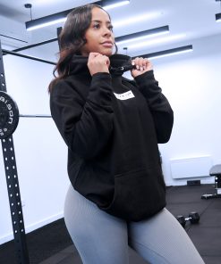 pretty girl at the gym squat rack wearing power x purpose love yourself hoodie