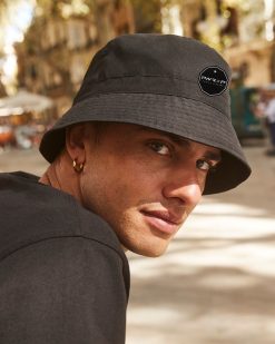 urban trendy guy wearing power x purpose bucket hat