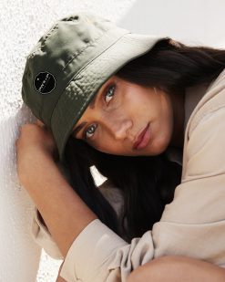 urban trendy girl wearing power x purpose bucket hat