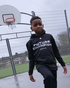 sporty child wearing kids power x purpose hoodie