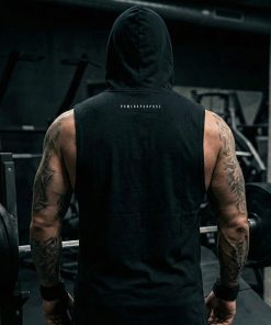 white muscular man standing in the gym wearing pwrxp power x purpose sleeveless muscle hoodie in black