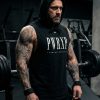 white muscular man standing in the gym wearing pwrxp power x purpose sleeveless muscle hoodie in black
