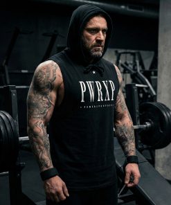 white muscular man standing in the gym wearing pwrxp power x purpose sleeveless muscle hoodie in black