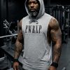 black muscular man standing in the gym wearing pwrxp power x purpose sleeveless muscle hoodie in grey