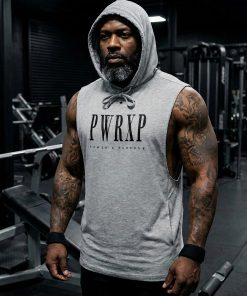 black muscular man standing in the gym wearing pwrxp power x purpose sleeveless muscle hoodie in grey
